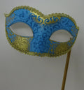 Turquoise Blue and Gold Masquerade Mask Hand Held on a Wooden Stick