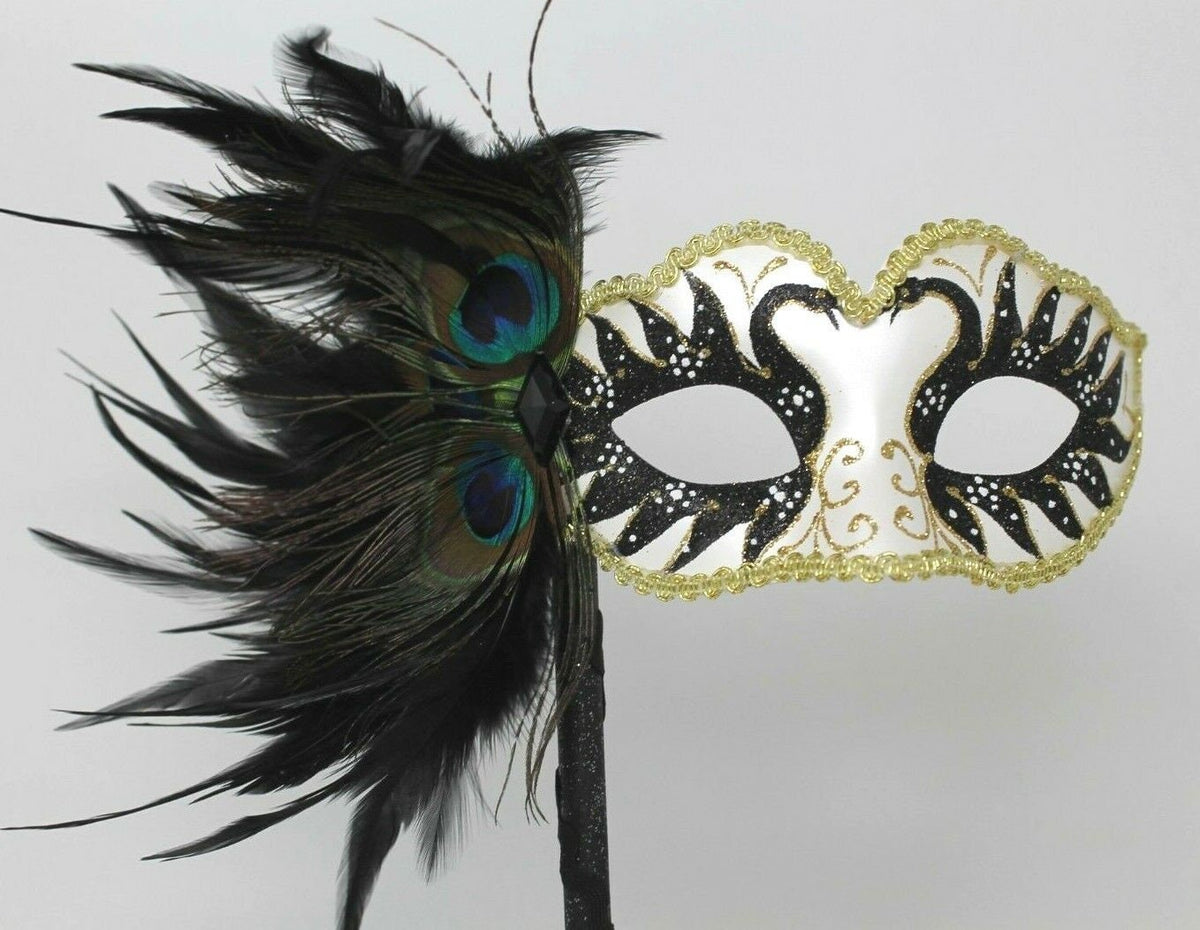 Gold White and Black Masquerade Mask on a Black Stick with Peacock Feathers