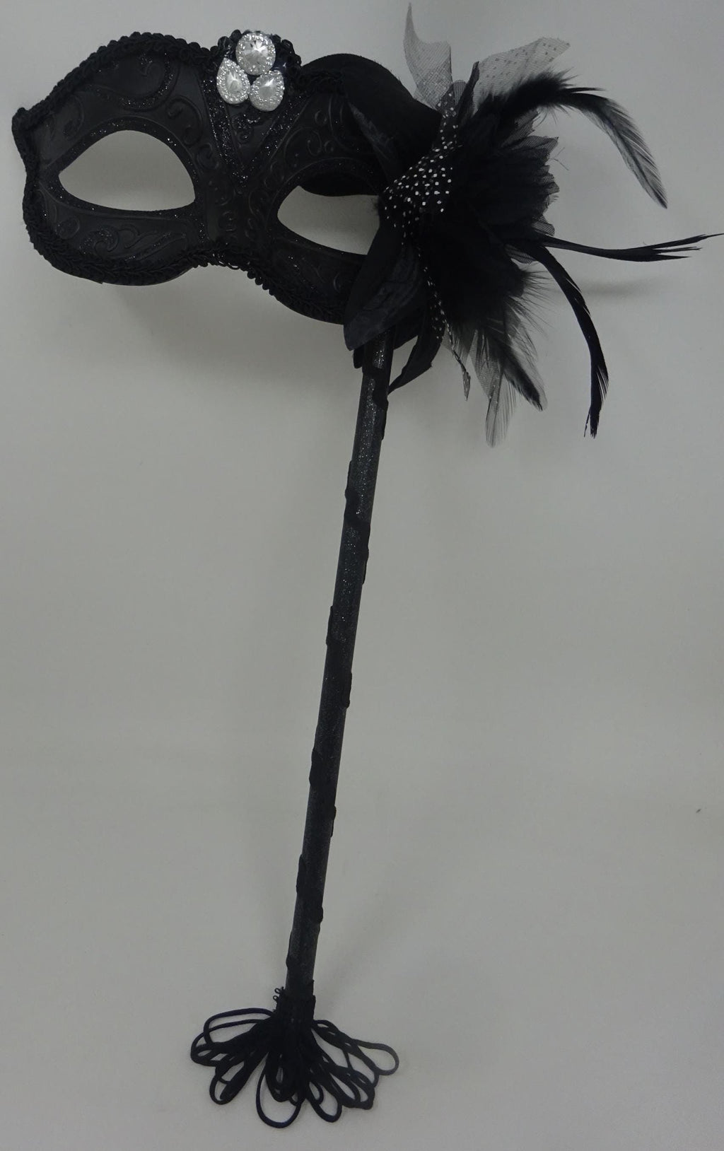Stunning Black Jewelled Masquerade Mask on a Black Stick with a Flower and Feathers