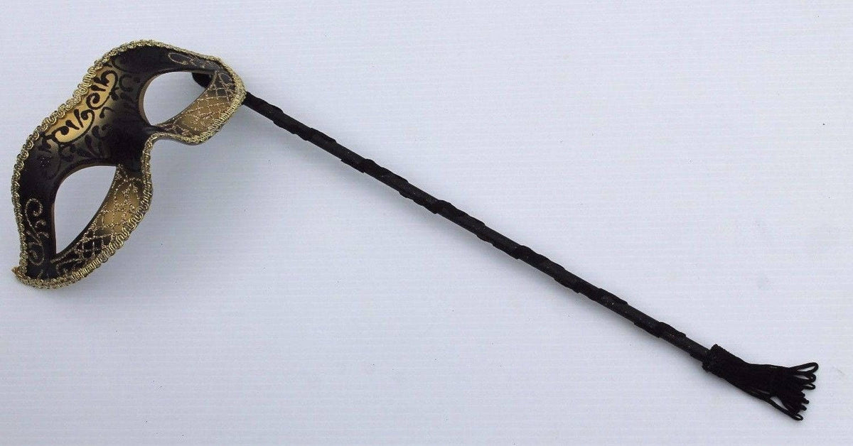 Glittering Black and Gold Masquerade Mask on a Black Stick