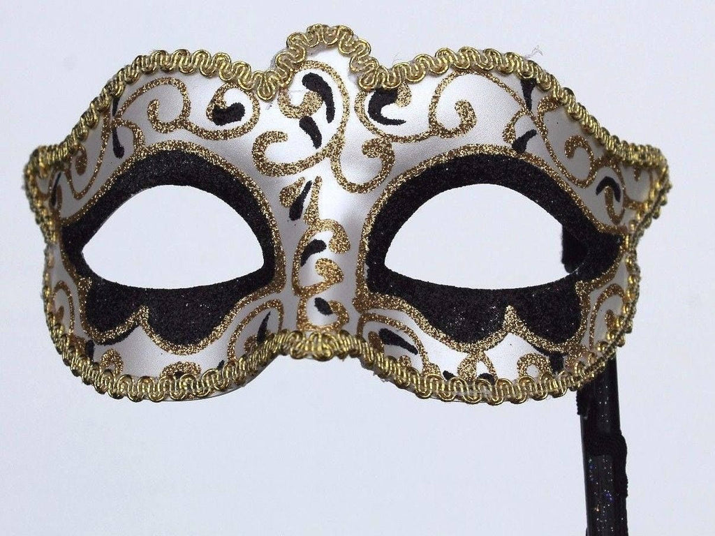 Glittering Black and Gold Masquerade Mask on a Gold Stick