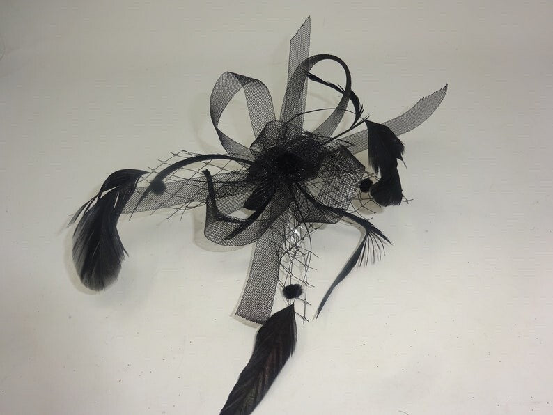 FLORAL ROSETTE DESIGN BLACK LOOP STIFFENED NET ENHANCED WITH LONG SLIM FEATHERS