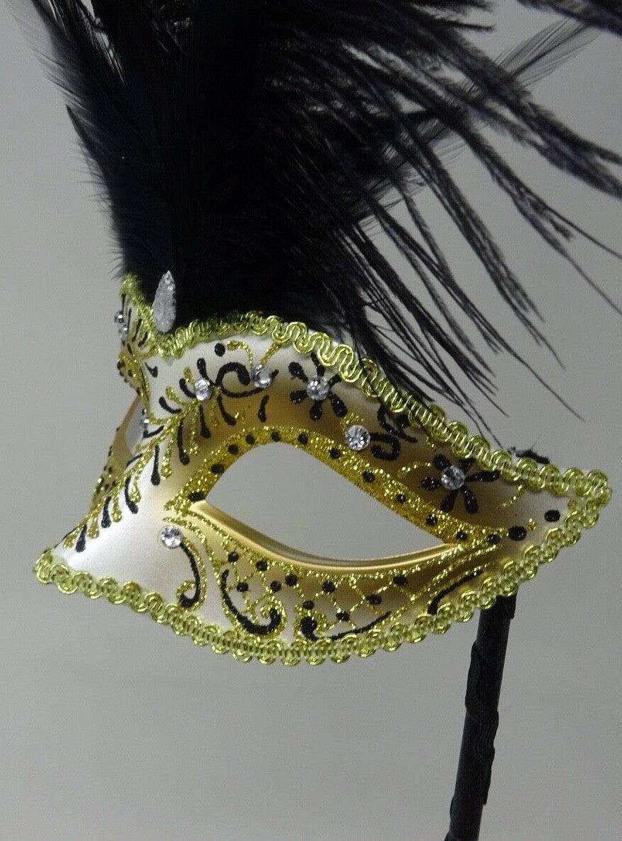 LADIES BLACK & GOLD VENETIAN MASQUERADE PARTY FEATHER MASK ON A HAND HELD STICK