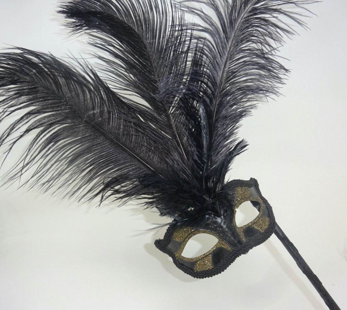 BLACK GOLD MASQUERADE CARNIVAL PARTY BALL WITH LONG FEATHERS EYE MASK ON A STICK