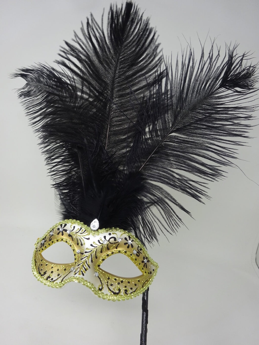 LADIES BLACK & GOLD VENETIAN MASQUERADE PARTY FEATHER MASK ON A HAND HELD STICK