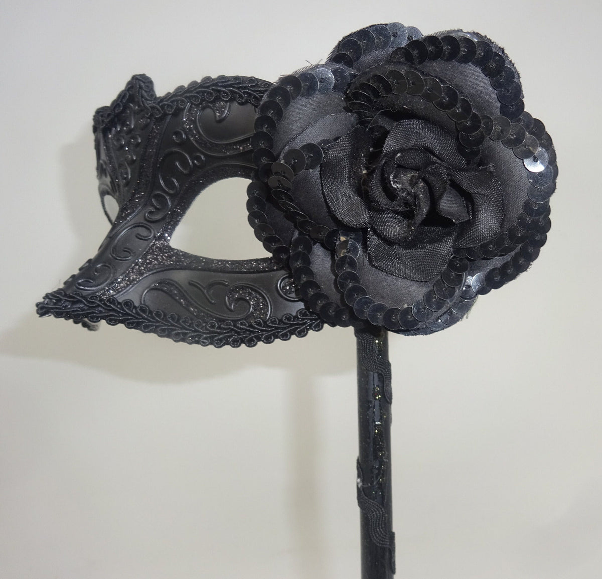 Black Venetian Masquerade Ball Carnival Eye Mask on a Stick with Flower Detail