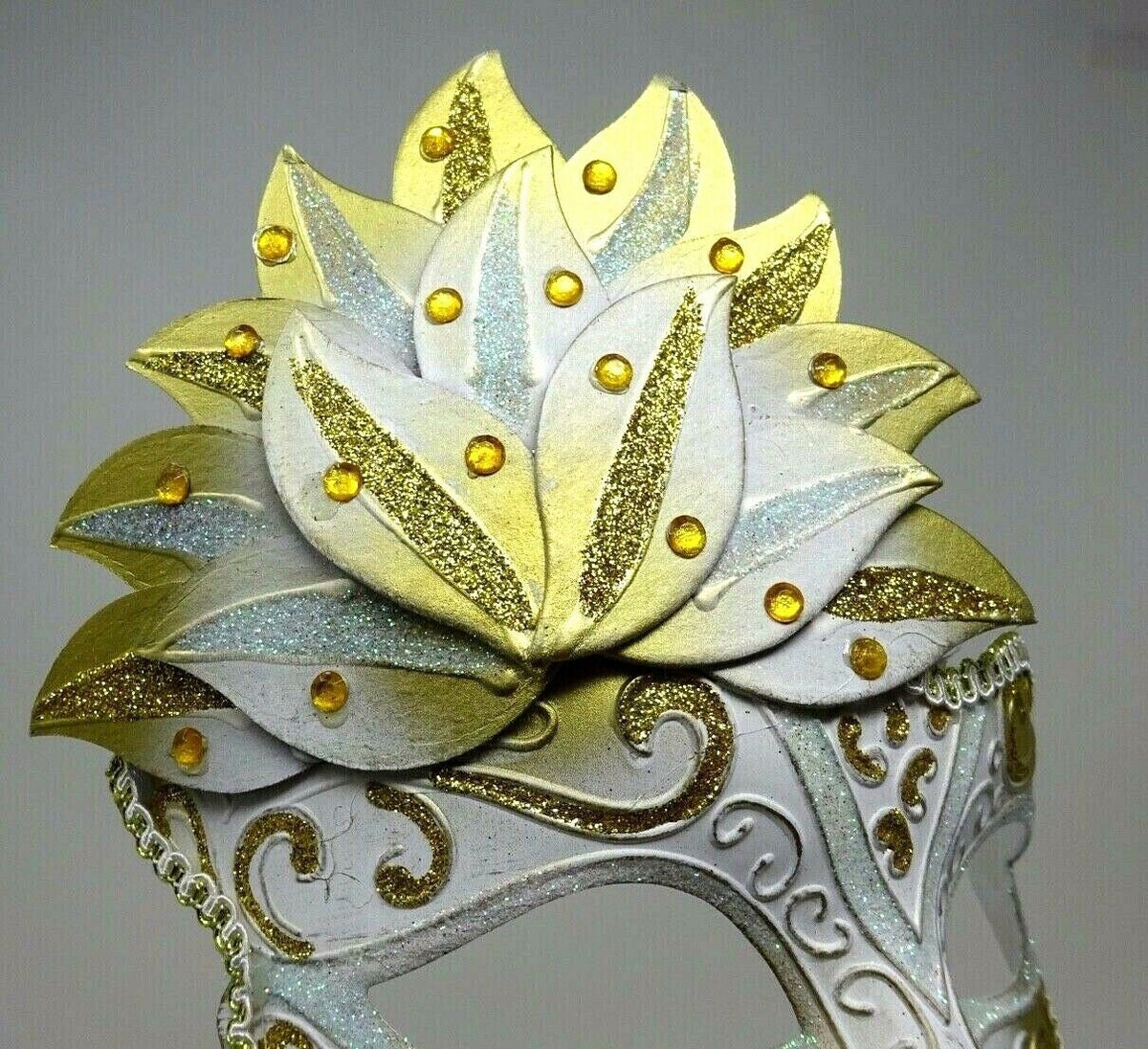 Ladies White and Gold Sparkling Masquerade Mask with Diamonte Detail Hand Held on a Wooden Stick