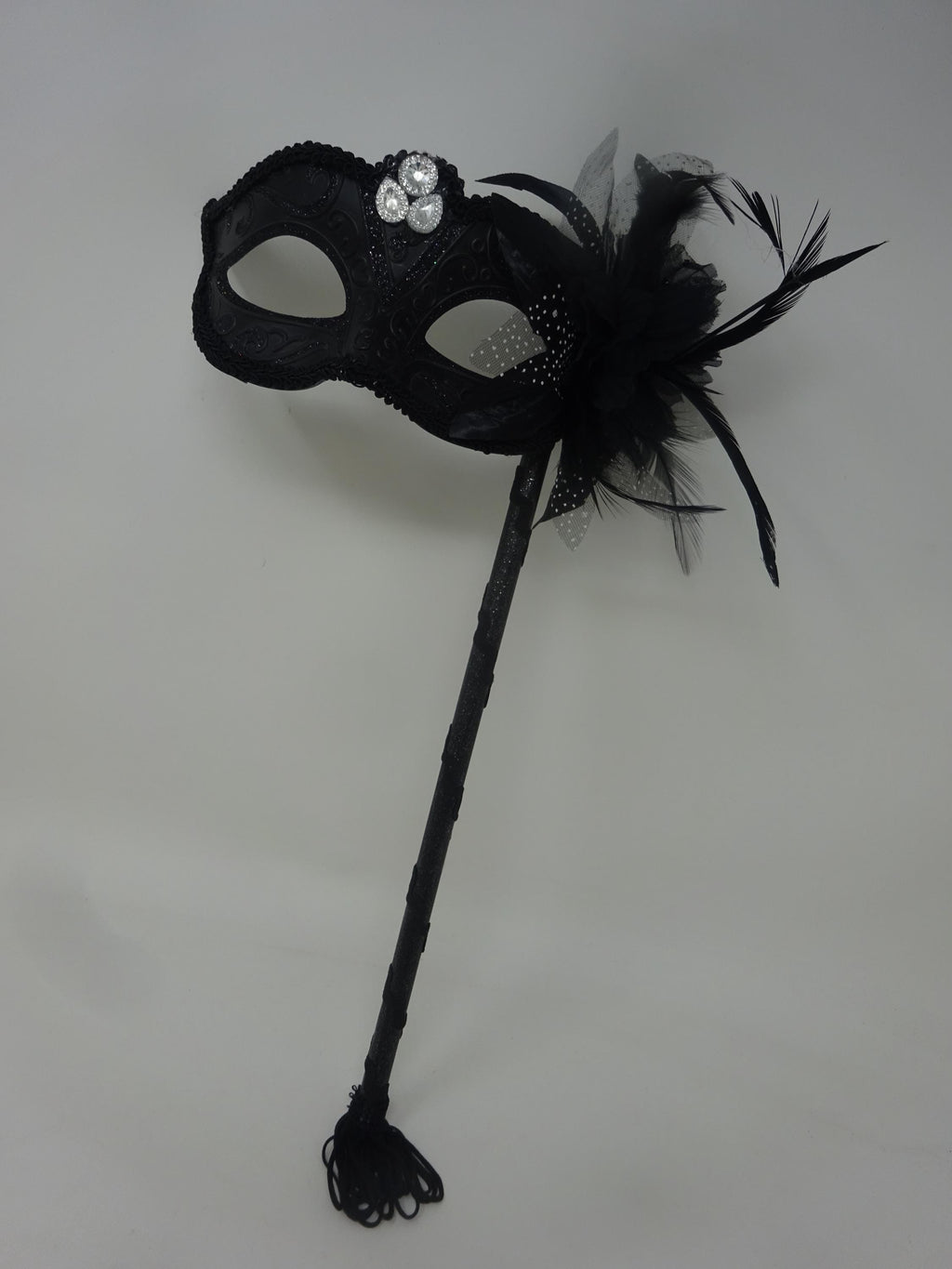 Ladies Black Jewelled Masquerade Mask on a Stick with Flower and Feathers