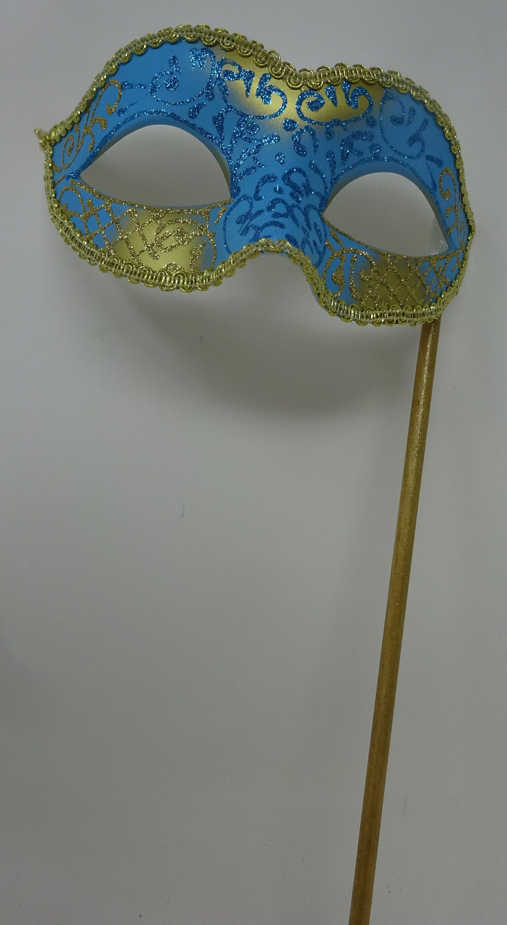 Turquoise Blue and Gold Masquerade Mask Hand Held on a Wooden Stick