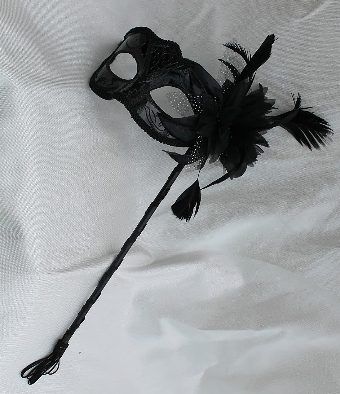 Stunning Black Masquerade Mask on a Black Stick with a flower made of black fabric petals, feathers and black and white organza