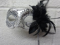 Stunning Black and Silver Feather Masquerade Mask with a Flower & Feathers on a Silver Stick