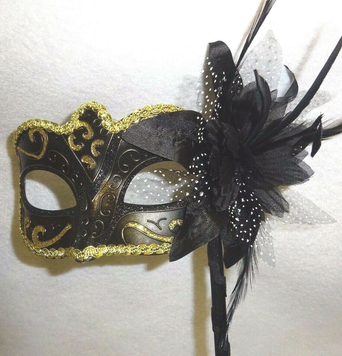 Stunning Black Bronze and Gold Masquerade Mask on a Black Stick with Flower