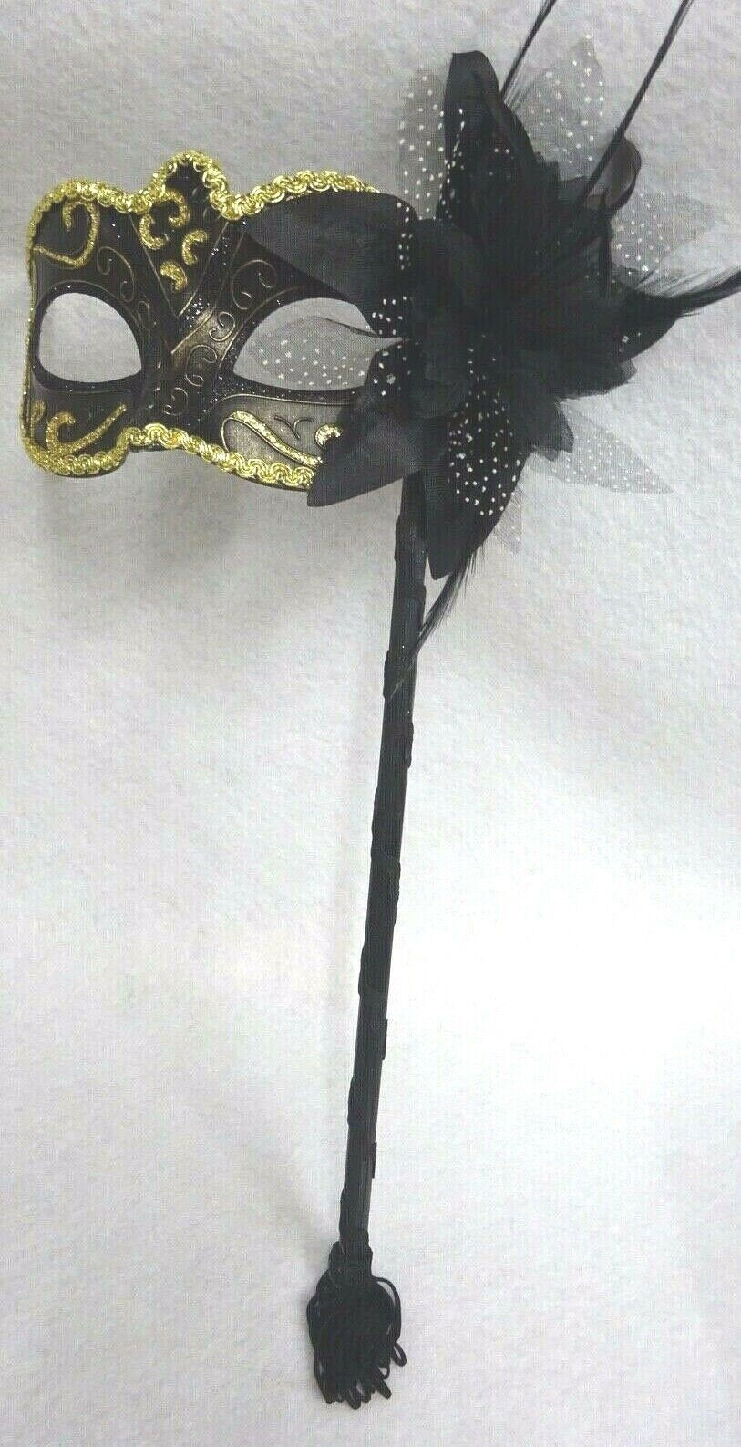 Stunning Black Bronze and Gold Masquerade Mask on a Black Stick with Flower