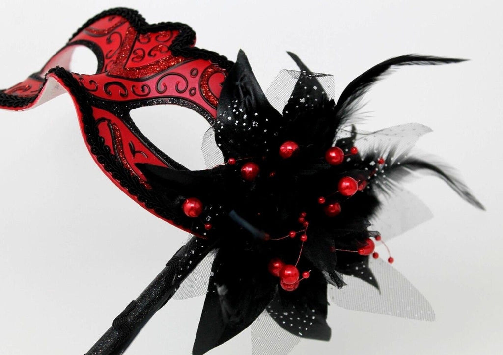 Red and Black Masquerade Mask on a Black Stick with Flower