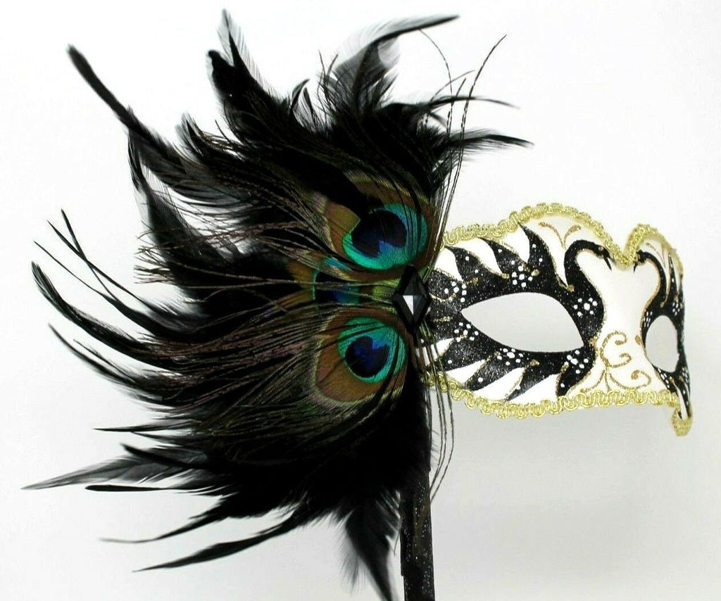Gold White and Black Masquerade Mask on a Black Stick with Peacock Feathers